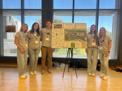 Students with presentation board